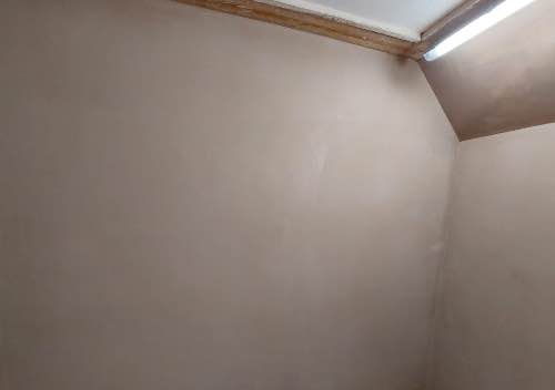 a plastered raked ceiling and walls completed by a learner during his training