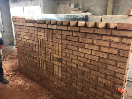 dog tooth finish to a brick wall