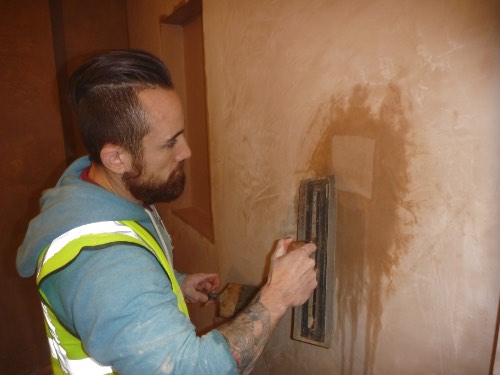 gent from manchester on a plastering course doing patch and repair work