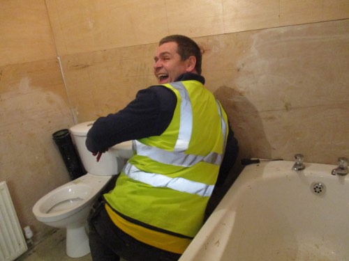 person fitting a bathroom suite