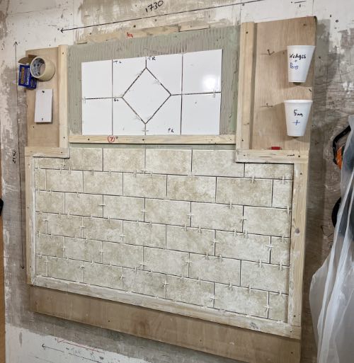 training board with brick bond and tile in tile feature